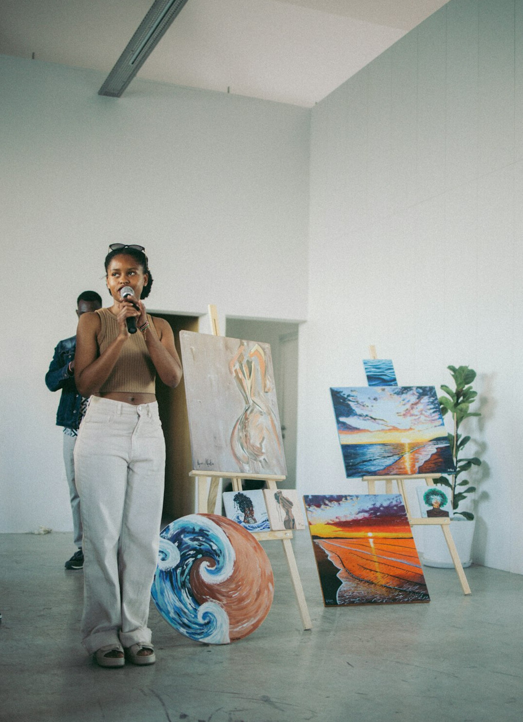 Female communication coach presenting to a group in a bright studio