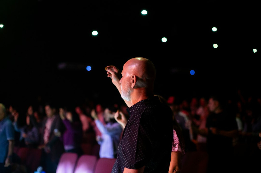 Person confidently speaking in front of an audience